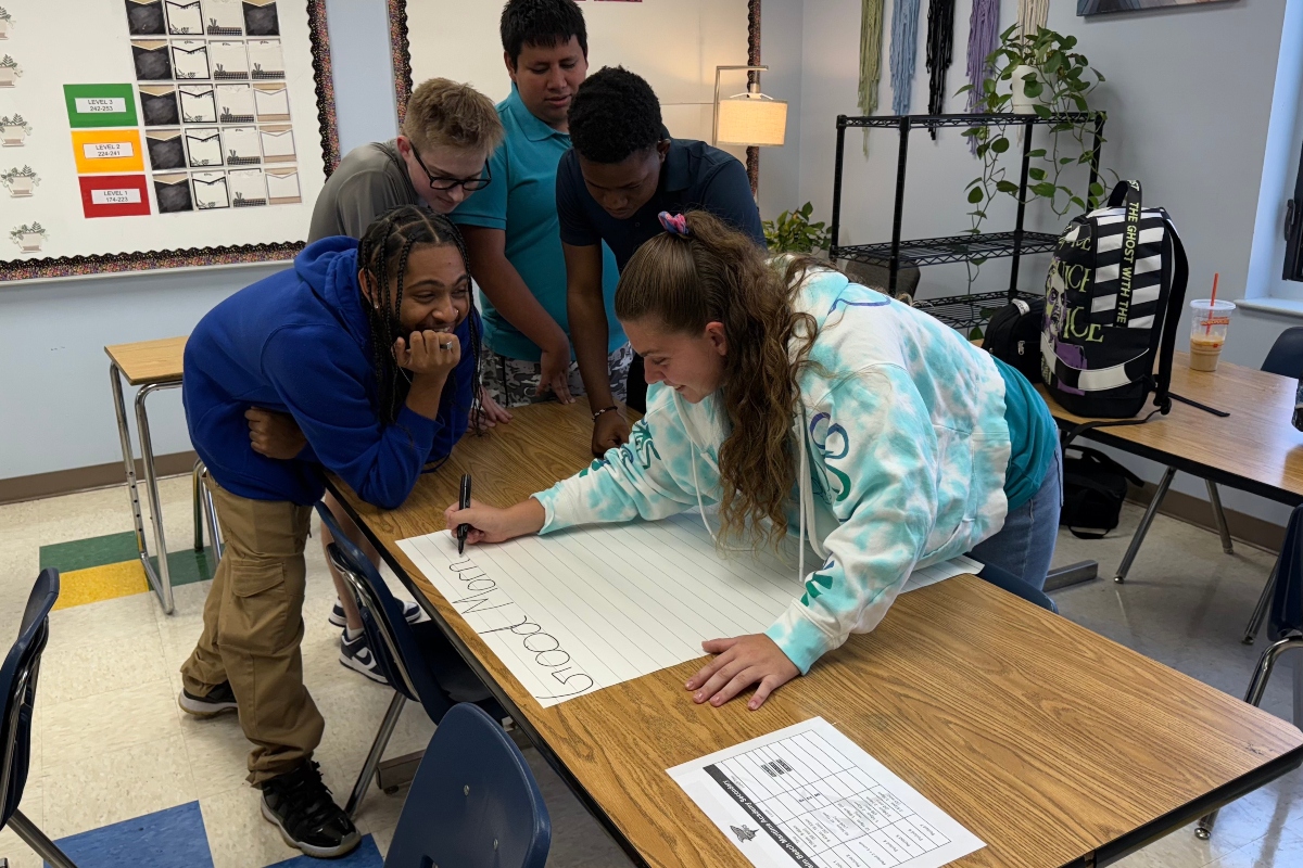 PBMA tuition-free charter school students working on a project together on a classroom table